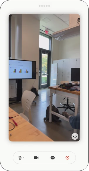 SafeStride phone interface displaying a camera view of a room